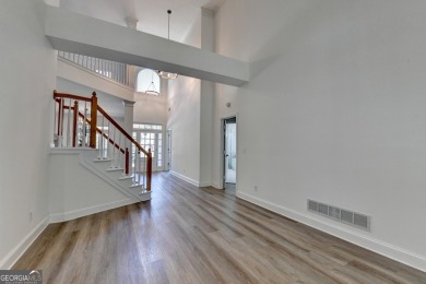 Discover a meticulously designed home that seamlessly blends on Canongate At Olde Atlanta Golf Club in Georgia - for sale on GolfHomes.com, golf home, golf lot