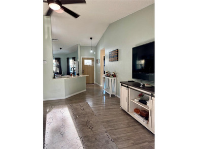 Check out this beautifully maintained home nestled in the on The Grand Club - Pine Lakes Course in Florida - for sale on GolfHomes.com, golf home, golf lot