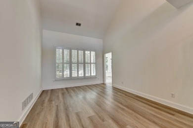 Discover a meticulously designed home that seamlessly blends on Canongate At Olde Atlanta Golf Club in Georgia - for sale on GolfHomes.com, golf home, golf lot
