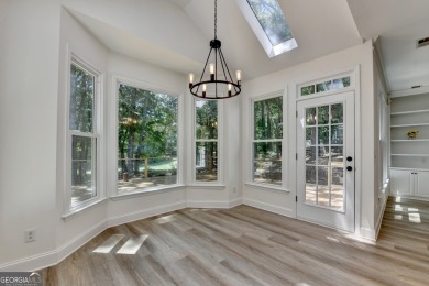 Discover a meticulously designed home that seamlessly blends on Canongate At Olde Atlanta Golf Club in Georgia - for sale on GolfHomes.com, golf home, golf lot