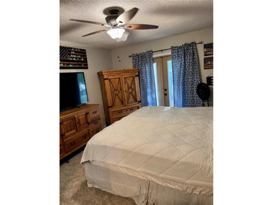 Check out this beautifully maintained home nestled in the on The Grand Club - Pine Lakes Course in Florida - for sale on GolfHomes.com, golf home, golf lot