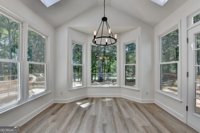 Discover a meticulously designed home that seamlessly blends on Canongate At Olde Atlanta Golf Club in Georgia - for sale on GolfHomes.com, golf home, golf lot
