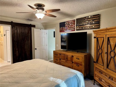 Check out this beautifully maintained home nestled in the on The Grand Club - Pine Lakes Course in Florida - for sale on GolfHomes.com, golf home, golf lot