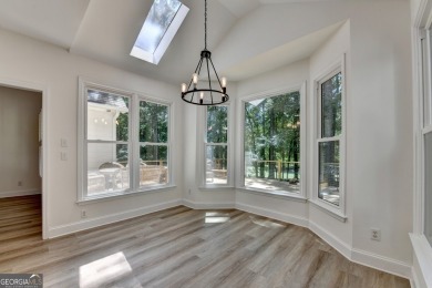 Discover a meticulously designed home that seamlessly blends on Canongate At Olde Atlanta Golf Club in Georgia - for sale on GolfHomes.com, golf home, golf lot