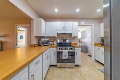 Welcome to this charming and move-in ready home in Sun City on Caloosa Greens Executive Golf Course in Florida - for sale on GolfHomes.com, golf home, golf lot