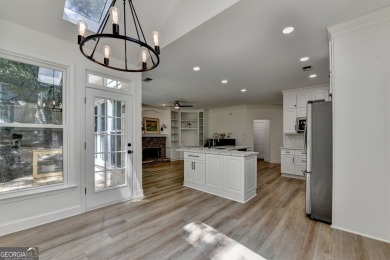 Discover a meticulously designed home that seamlessly blends on Canongate At Olde Atlanta Golf Club in Georgia - for sale on GolfHomes.com, golf home, golf lot