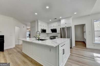 Discover a meticulously designed home that seamlessly blends on Canongate At Olde Atlanta Golf Club in Georgia - for sale on GolfHomes.com, golf home, golf lot