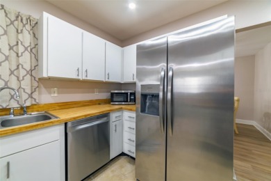 Welcome to this charming and move-in ready home in Sun City on Caloosa Greens Executive Golf Course in Florida - for sale on GolfHomes.com, golf home, golf lot