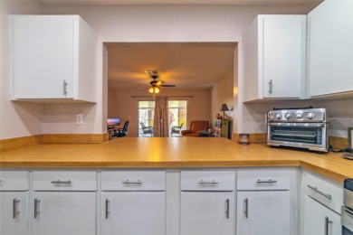 Welcome to this charming and move-in ready home in Sun City on Caloosa Greens Executive Golf Course in Florida - for sale on GolfHomes.com, golf home, golf lot