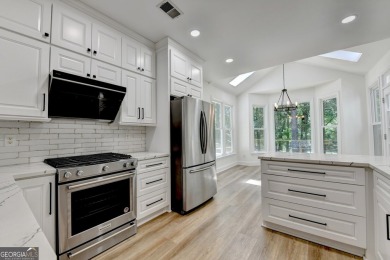Discover a meticulously designed home that seamlessly blends on Canongate At Olde Atlanta Golf Club in Georgia - for sale on GolfHomes.com, golf home, golf lot