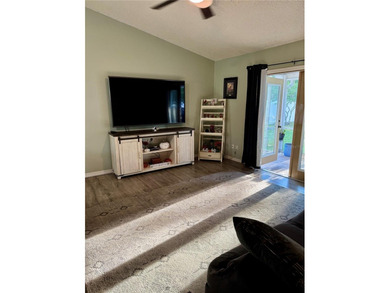 Check out this beautifully maintained home nestled in the on The Grand Club - Pine Lakes Course in Florida - for sale on GolfHomes.com, golf home, golf lot