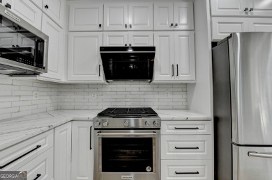 Discover a meticulously designed home that seamlessly blends on Canongate At Olde Atlanta Golf Club in Georgia - for sale on GolfHomes.com, golf home, golf lot