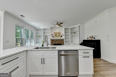 Discover a meticulously designed home that seamlessly blends on Canongate At Olde Atlanta Golf Club in Georgia - for sale on GolfHomes.com, golf home, golf lot