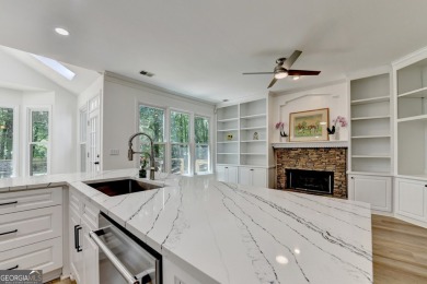 Discover a meticulously designed home that seamlessly blends on Canongate At Olde Atlanta Golf Club in Georgia - for sale on GolfHomes.com, golf home, golf lot