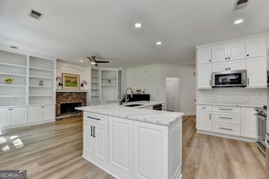 Discover a meticulously designed home that seamlessly blends on Canongate At Olde Atlanta Golf Club in Georgia - for sale on GolfHomes.com, golf home, golf lot