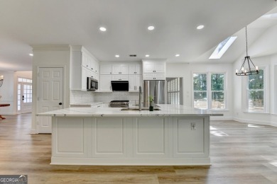 Discover a meticulously designed home that seamlessly blends on Canongate At Olde Atlanta Golf Club in Georgia - for sale on GolfHomes.com, golf home, golf lot