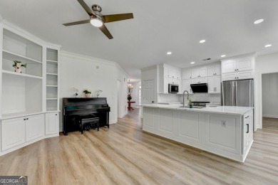 Discover a meticulously designed home that seamlessly blends on Canongate At Olde Atlanta Golf Club in Georgia - for sale on GolfHomes.com, golf home, golf lot