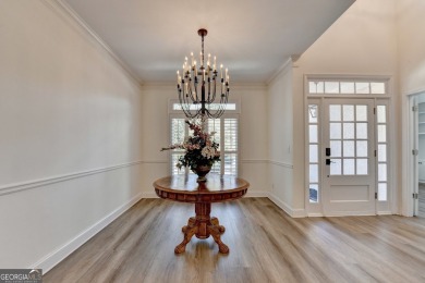 Discover a meticulously designed home that seamlessly blends on Canongate At Olde Atlanta Golf Club in Georgia - for sale on GolfHomes.com, golf home, golf lot