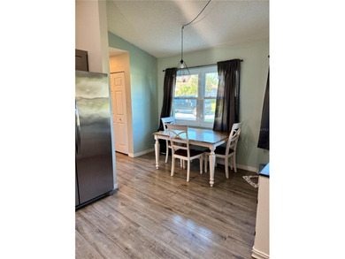 Check out this beautifully maintained home nestled in the on The Grand Club - Pine Lakes Course in Florida - for sale on GolfHomes.com, golf home, golf lot