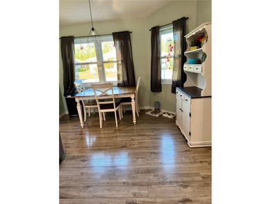 Check out this beautifully maintained home nestled in the on The Grand Club - Pine Lakes Course in Florida - for sale on GolfHomes.com, golf home, golf lot