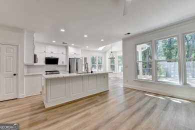 Discover a meticulously designed home that seamlessly blends on Canongate At Olde Atlanta Golf Club in Georgia - for sale on GolfHomes.com, golf home, golf lot