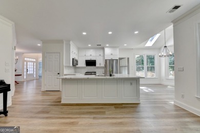 Discover a meticulously designed home that seamlessly blends on Canongate At Olde Atlanta Golf Club in Georgia - for sale on GolfHomes.com, golf home, golf lot