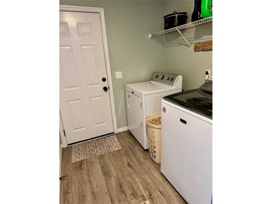 Check out this beautifully maintained home nestled in the on The Grand Club - Pine Lakes Course in Florida - for sale on GolfHomes.com, golf home, golf lot