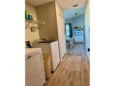 Check out this beautifully maintained home nestled in the on The Grand Club - Pine Lakes Course in Florida - for sale on GolfHomes.com, golf home, golf lot