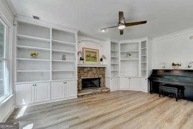 Discover a meticulously designed home that seamlessly blends on Canongate At Olde Atlanta Golf Club in Georgia - for sale on GolfHomes.com, golf home, golf lot