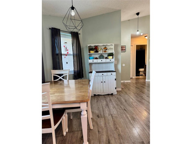 Check out this beautifully maintained home nestled in the on The Grand Club - Pine Lakes Course in Florida - for sale on GolfHomes.com, golf home, golf lot