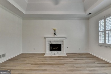 Discover a meticulously designed home that seamlessly blends on Canongate At Olde Atlanta Golf Club in Georgia - for sale on GolfHomes.com, golf home, golf lot