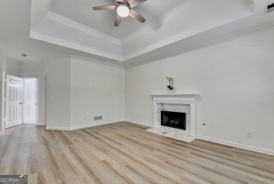 Discover a meticulously designed home that seamlessly blends on Canongate At Olde Atlanta Golf Club in Georgia - for sale on GolfHomes.com, golf home, golf lot