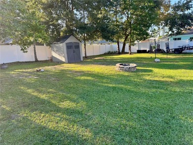 Check out this beautifully maintained home nestled in the on The Grand Club - Pine Lakes Course in Florida - for sale on GolfHomes.com, golf home, golf lot