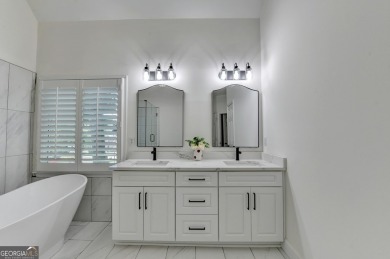 Discover a meticulously designed home that seamlessly blends on Canongate At Olde Atlanta Golf Club in Georgia - for sale on GolfHomes.com, golf home, golf lot