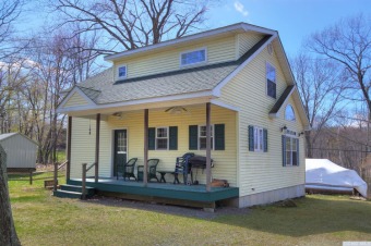 Bright and cheery Copake Lake home. 3 BR, 2 BA, rocking chair on Copake Country Club in New York - for sale on GolfHomes.com, golf home, golf lot
