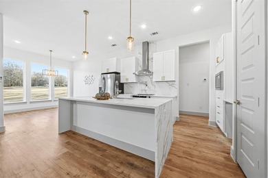 Exquisite home has four bedrooms, two and half bathrooms.  1,953 on White Bluff Resort - New Course in Texas - for sale on GolfHomes.com, golf home, golf lot