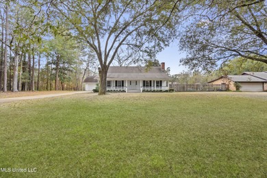 Beautiful Southern style home nestled on a serene 1 1/2 acre on Mississippi National Golf Course in Mississippi - for sale on GolfHomes.com, golf home, golf lot