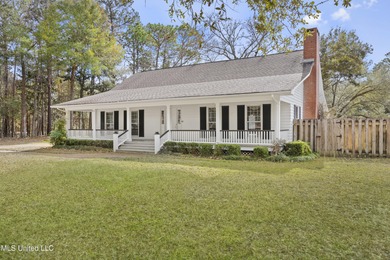 Beautiful Southern style home nestled on a serene 1 1/2 acre on Mississippi National Golf Course in Mississippi - for sale on GolfHomes.com, golf home, golf lot