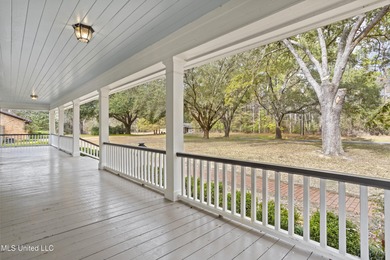 Beautiful Southern style home nestled on a serene 1 1/2 acre on Mississippi National Golf Course in Mississippi - for sale on GolfHomes.com, golf home, golf lot