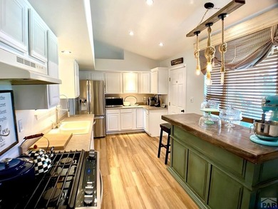 Welcome to this beautifully maintained 4-bedroom, 3-bathroom on Desert Hawk At Pueblo West in Colorado - for sale on GolfHomes.com, golf home, golf lot