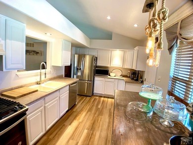 Welcome to this beautifully maintained 4-bedroom, 3-bathroom on Desert Hawk At Pueblo West in Colorado - for sale on GolfHomes.com, golf home, golf lot