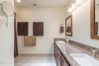 Discover this beautifully maintained 3-bed, 2-bath canal front on The Club At Pelican Bay - North Course in Florida - for sale on GolfHomes.com, golf home, golf lot