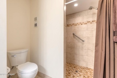Discover this beautifully maintained 3-bed, 2-bath canal front on The Club At Pelican Bay - North Course in Florida - for sale on GolfHomes.com, golf home, golf lot