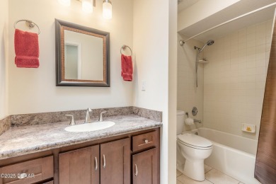 Discover this beautifully maintained 3-bed, 2-bath canal front on The Club At Pelican Bay - North Course in Florida - for sale on GolfHomes.com, golf home, golf lot