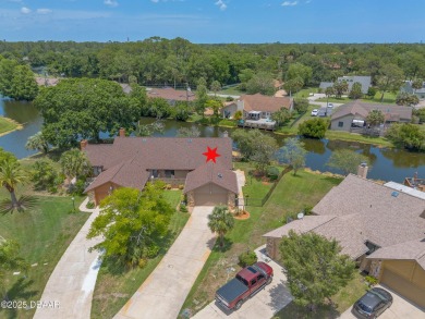 Discover this beautifully maintained 3-bed, 2-bath canal front on The Club At Pelican Bay - North Course in Florida - for sale on GolfHomes.com, golf home, golf lot
