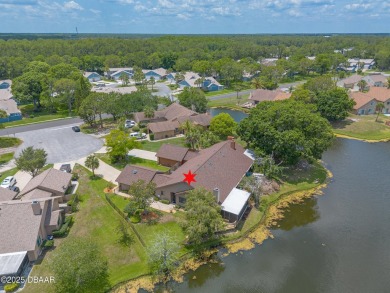Discover this beautifully maintained 3-bed, 2-bath canal front on The Club At Pelican Bay - North Course in Florida - for sale on GolfHomes.com, golf home, golf lot