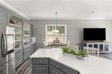 Tucked behind a canopy of mature trees, this beautifully on Oak Grove Island Golf and Country Club in Georgia - for sale on GolfHomes.com, golf home, golf lot