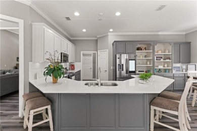 Tucked behind a canopy of mature trees, this beautifully on Oak Grove Island Golf and Country Club in Georgia - for sale on GolfHomes.com, golf home, golf lot
