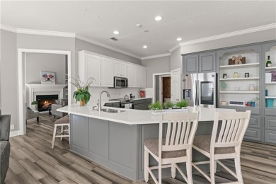 Tucked behind a canopy of mature trees, this beautifully on Oak Grove Island Golf and Country Club in Georgia - for sale on GolfHomes.com, golf home, golf lot
