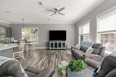 Tucked behind a canopy of mature trees, this beautifully on Oak Grove Island Golf and Country Club in Georgia - for sale on GolfHomes.com, golf home, golf lot